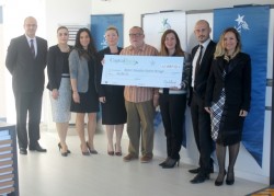 Presentation of cheque - Capital Bank Catalkoy l-r Ferit Kurtoglu, Vusala Hasanova, Narcin Timur, Selman Pasa, Art Watson, Sena Alanmaz, Birtan Nazim, Zehra Tanisik.jpg